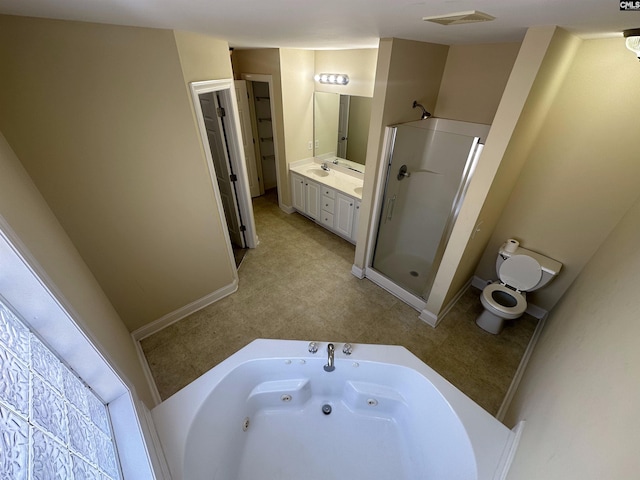 full bathroom featuring vanity, toilet, and separate shower and tub