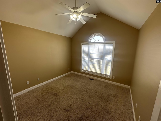 carpeted spare room featuring lofted ceiling and ceiling fan