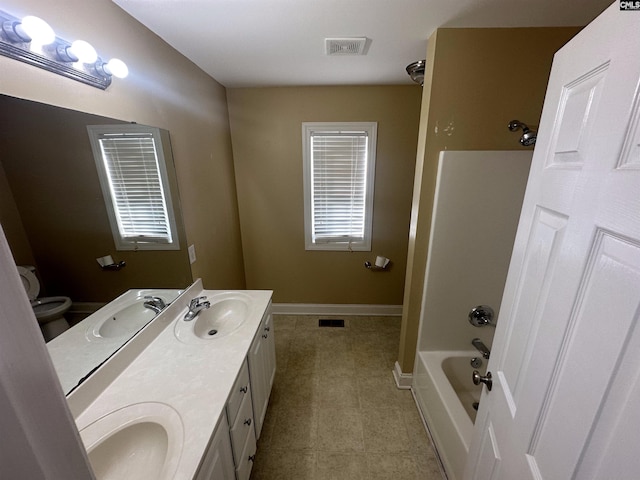 full bathroom with vanity, toilet, tile patterned floors, and bathing tub / shower combination