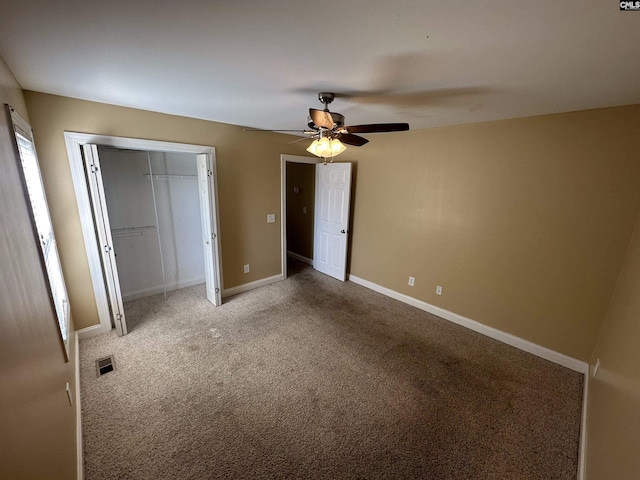 unfurnished bedroom with carpet floors and ceiling fan