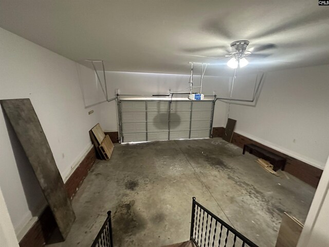 garage featuring a garage door opener and ceiling fan