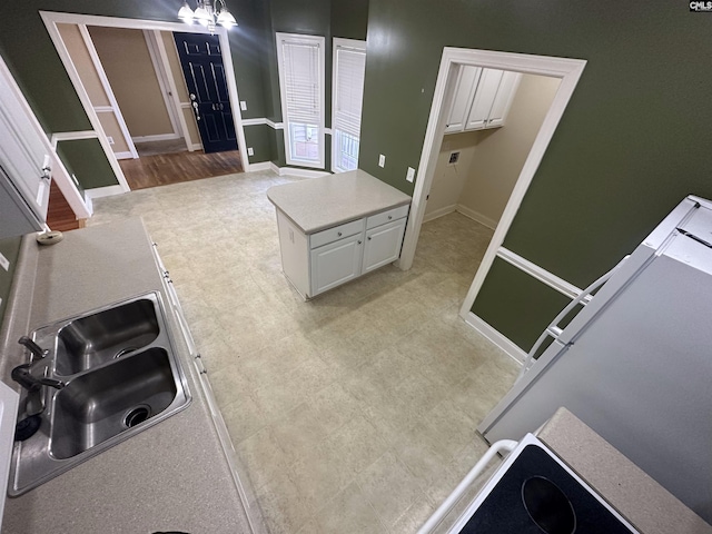 kitchen featuring light hardwood / wood-style flooring and white cabinets