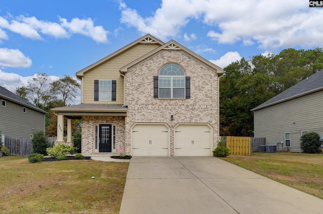 view of front of home featuring a garage and a front lawn