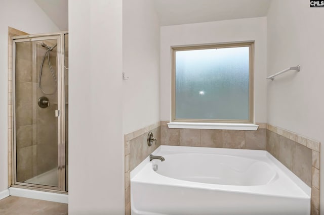 bathroom featuring tile patterned floors and plus walk in shower