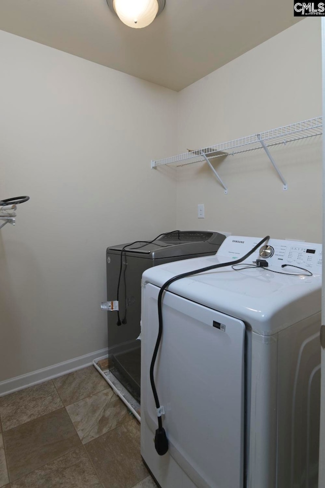 laundry room with independent washer and dryer