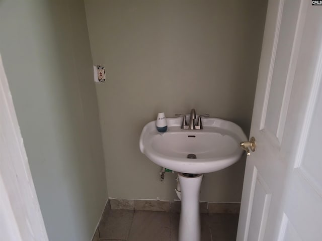 bathroom with tile patterned floors