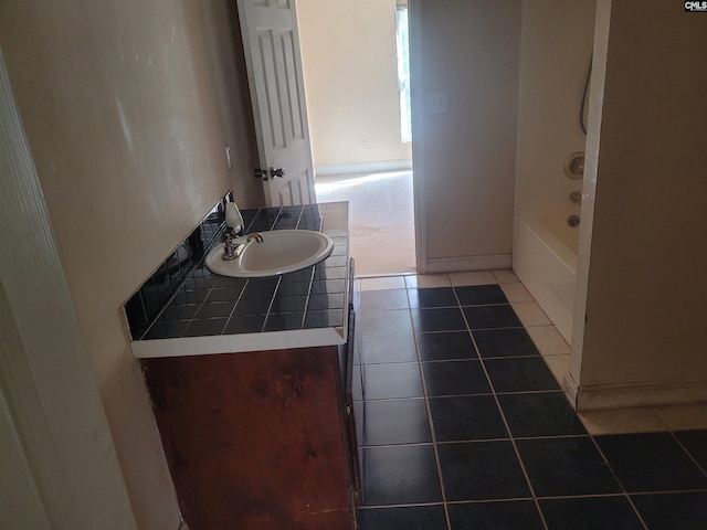 bathroom featuring vanity, shower / bathtub combination, and tile patterned flooring