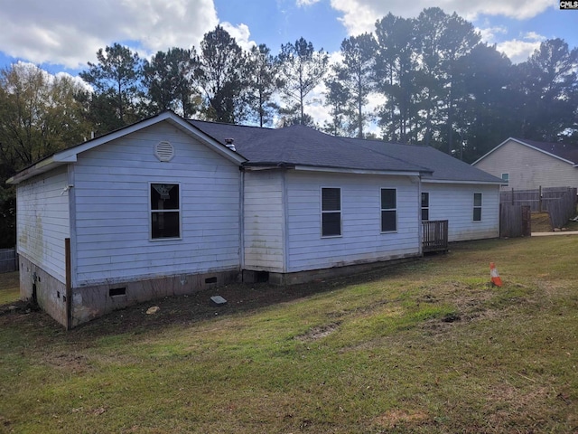 rear view of house with a lawn