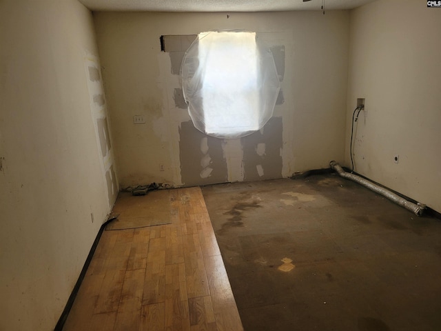 spare room featuring wood-type flooring