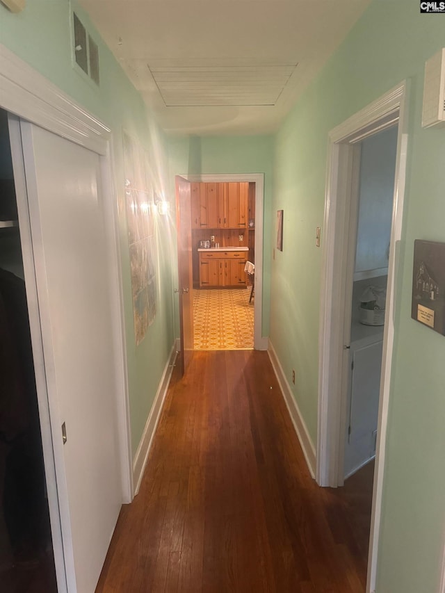 corridor featuring dark hardwood / wood-style flooring