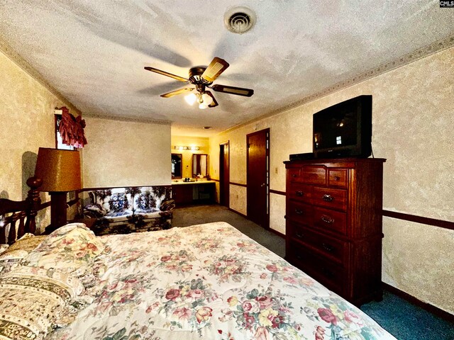 carpeted bedroom with a textured ceiling and ceiling fan