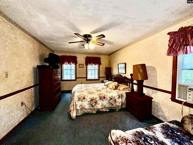 bedroom with multiple windows, a textured ceiling, and ceiling fan