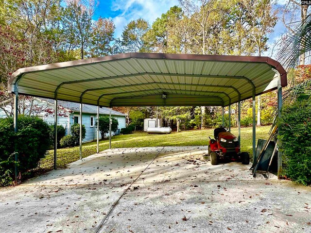 view of vehicle parking featuring a lawn and a carport