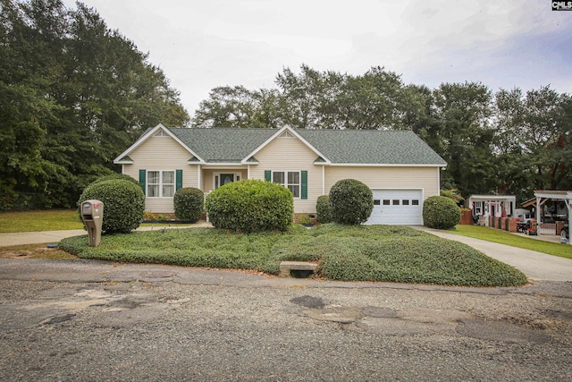 view of front facade with a front yard and a garage