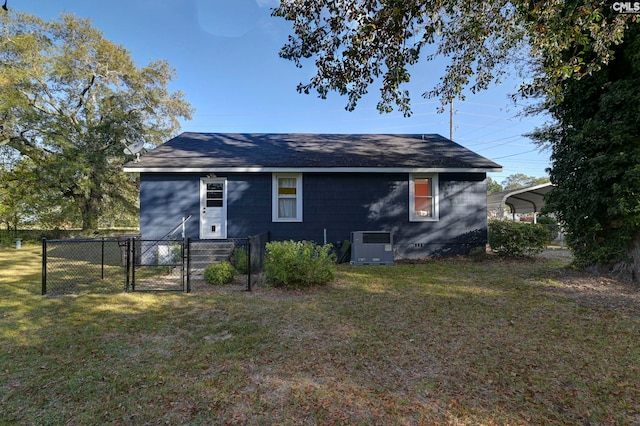 back of house featuring a yard