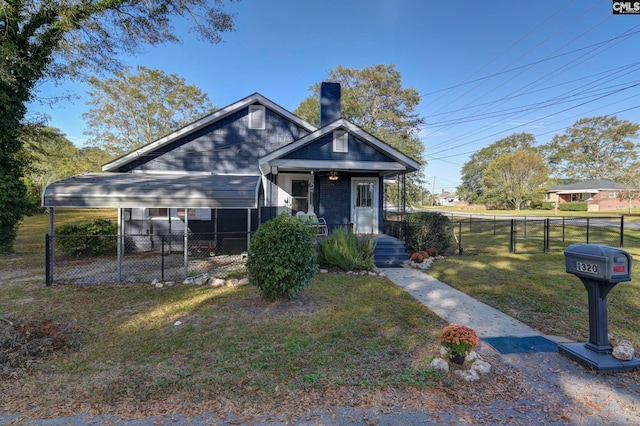 bungalow featuring a front yard and covered porch