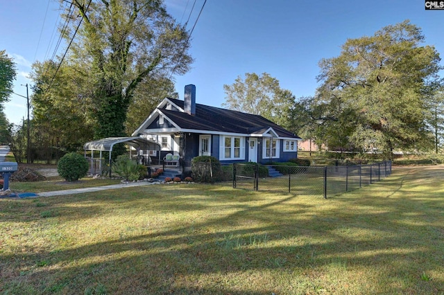 view of front of house with a front yard and a carport