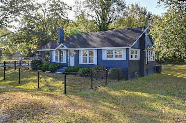 ranch-style home featuring a front lawn