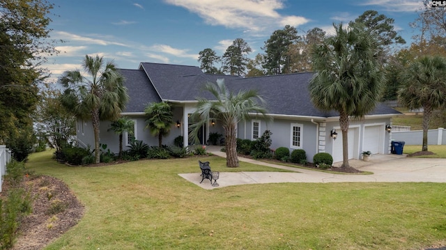 ranch-style house with a front yard and a garage