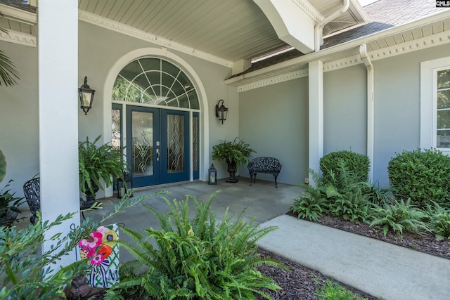 view of exterior entry featuring french doors