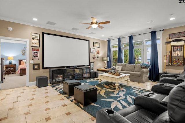 tiled cinema featuring ceiling fan, crown molding, and a fireplace