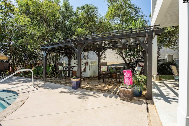 view of patio / terrace with a pergola and a pool