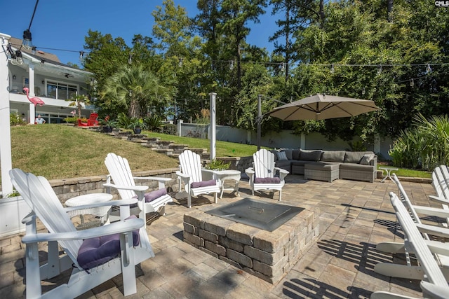 view of patio / terrace featuring an outdoor living space with a fire pit