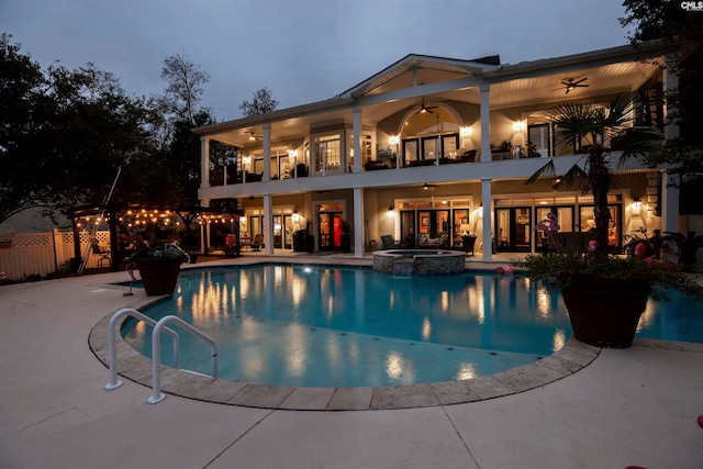 view of swimming pool with a patio area, an in ground hot tub, and ceiling fan