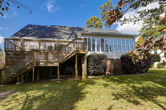 back of property featuring a yard and a wooden deck