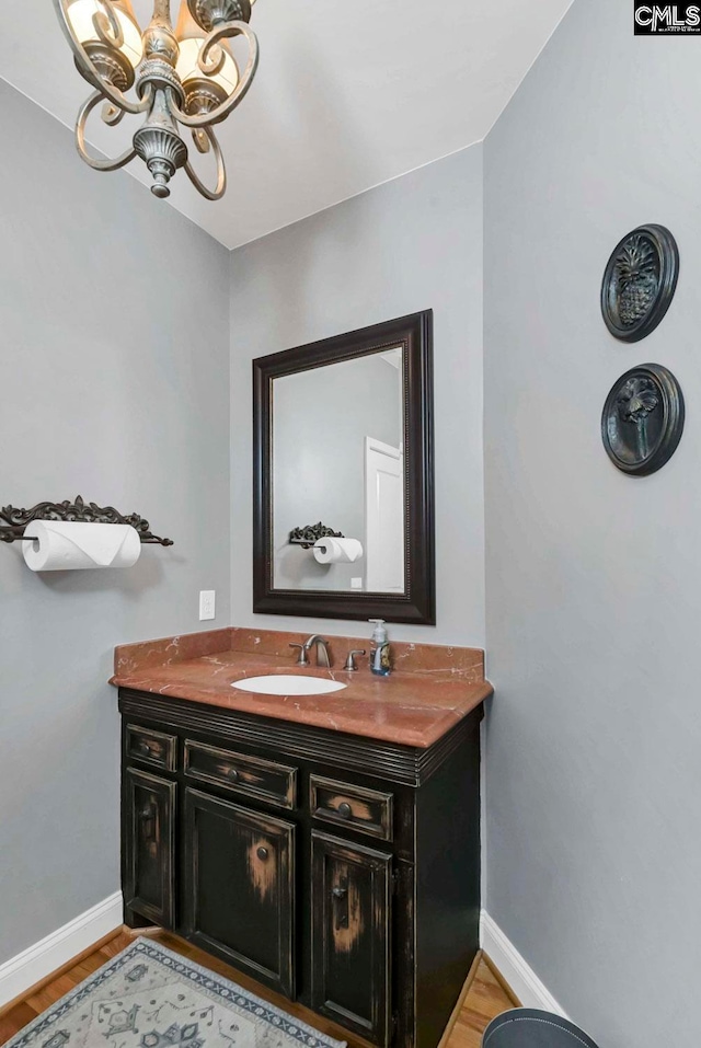 bathroom featuring vanity and hardwood / wood-style floors