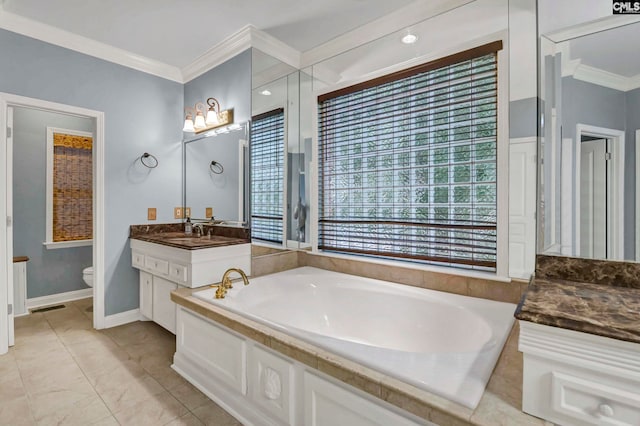 bathroom with vanity, a tub, crown molding, and toilet