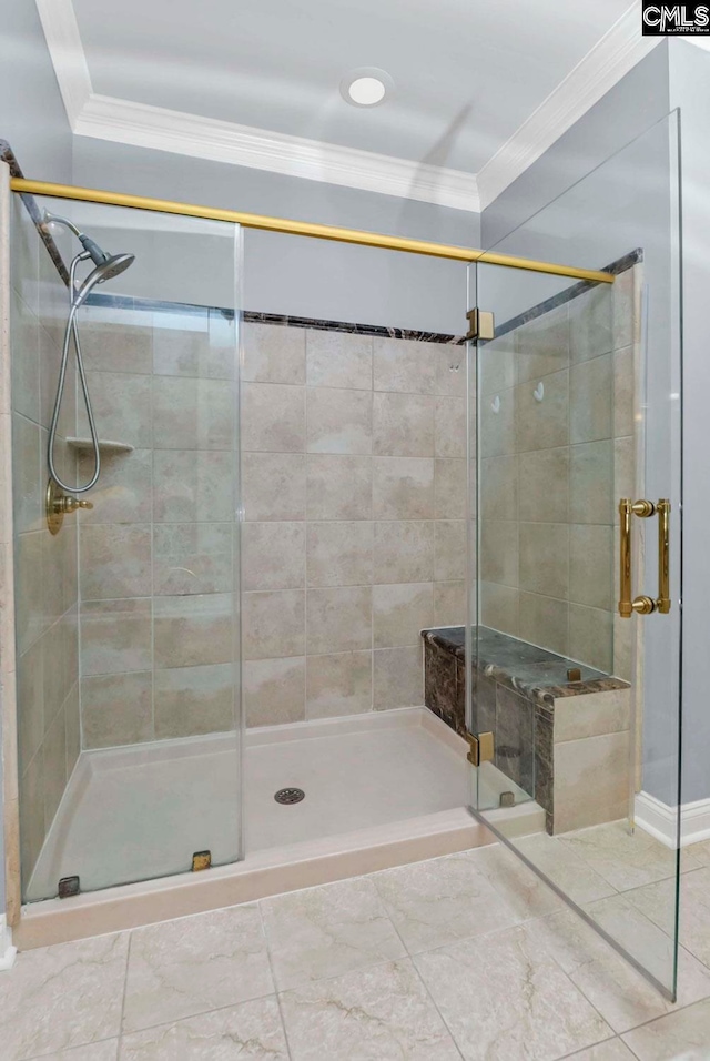 bathroom with crown molding and walk in shower