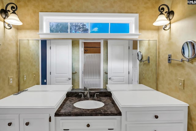 bathroom with vanity and a healthy amount of sunlight