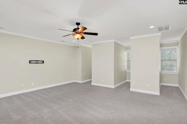 carpeted empty room with ornamental molding and ceiling fan