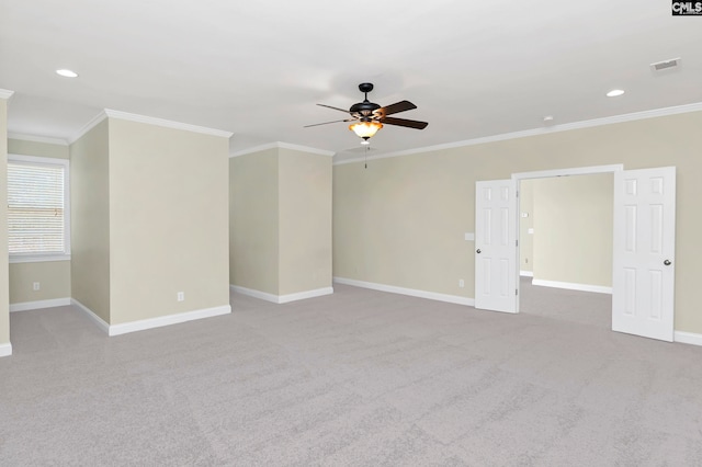 unfurnished room with crown molding, carpet floors, and ceiling fan