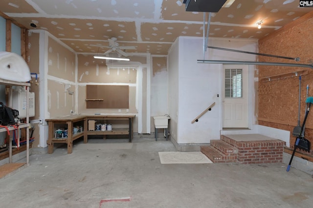 garage with sink and ceiling fan