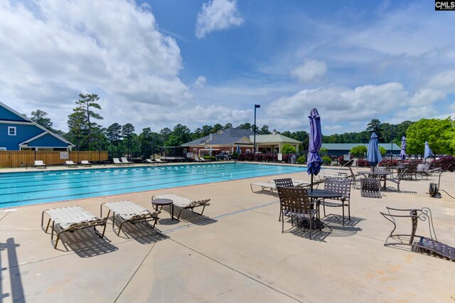 view of swimming pool featuring a patio