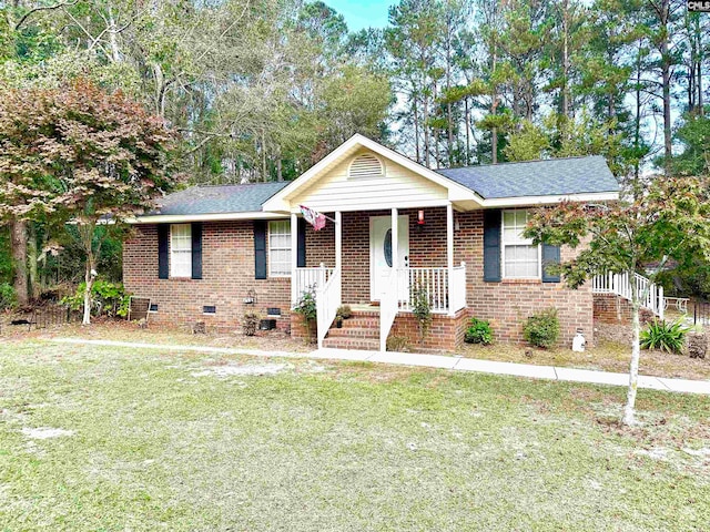 view of front of house with a front yard and a porch