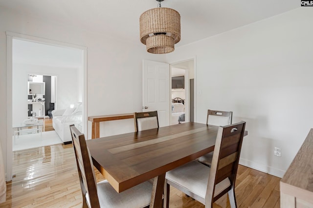 dining space with light hardwood / wood-style floors