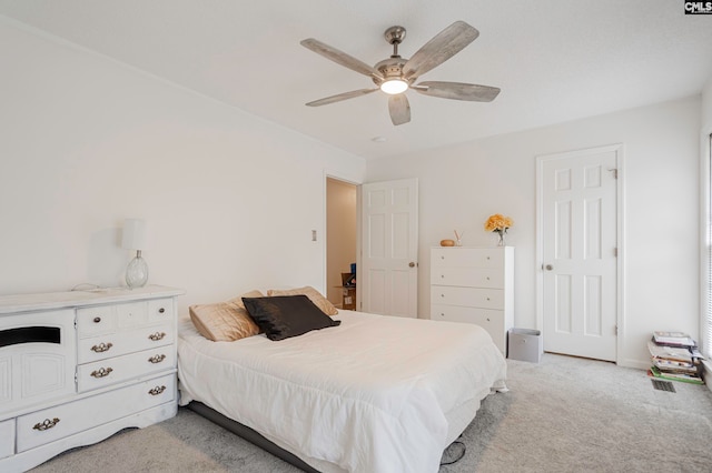 carpeted bedroom featuring ceiling fan