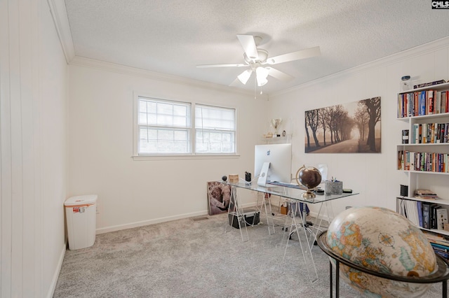 carpeted home office with crown molding, a textured ceiling, and ceiling fan