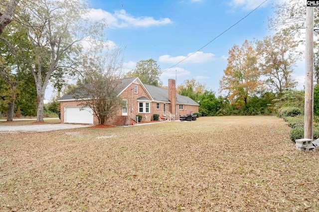 view of front of house with a front yard and a garage