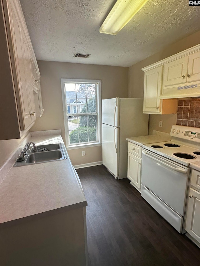 kitchen with white cabinets, dark hardwood / wood-style floors, custom range hood, sink, and white appliances