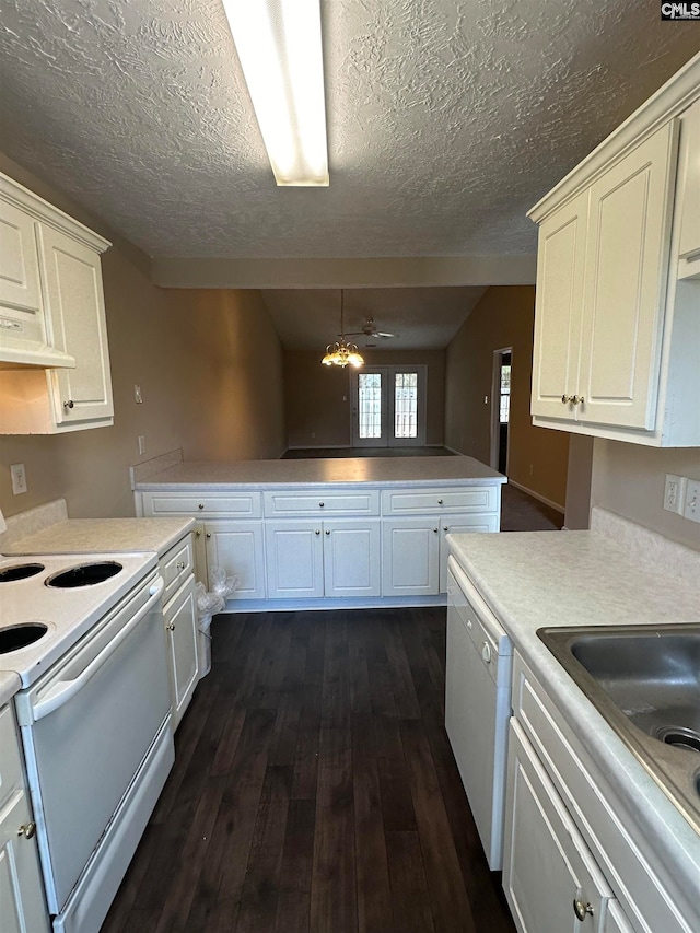 kitchen with dark hardwood / wood-style flooring, ceiling fan, a textured ceiling, range hood, and white appliances