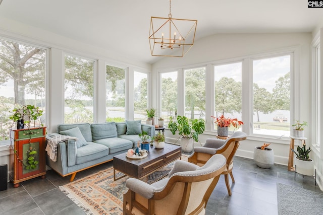 sunroom featuring vaulted ceiling and a notable chandelier