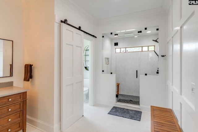 bathroom with vanity, crown molding, toilet, and tiled shower