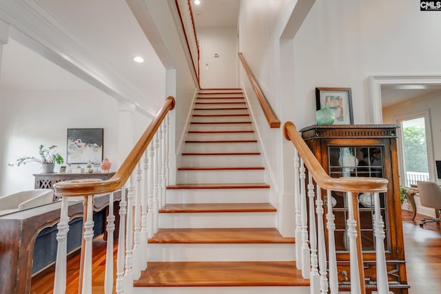 stairs with hardwood / wood-style floors