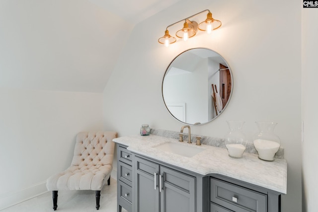 bathroom featuring vanity and vaulted ceiling