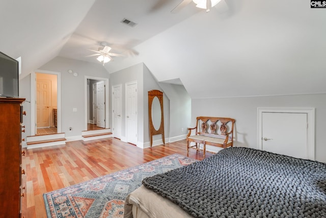 bedroom featuring lofted ceiling, hardwood / wood-style flooring, and ceiling fan