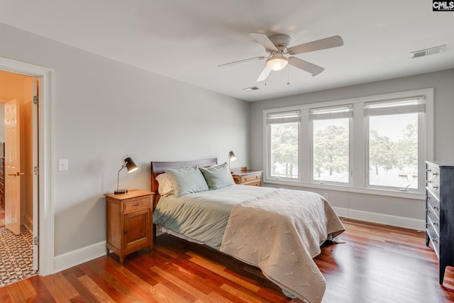 bedroom with hardwood / wood-style flooring and ceiling fan